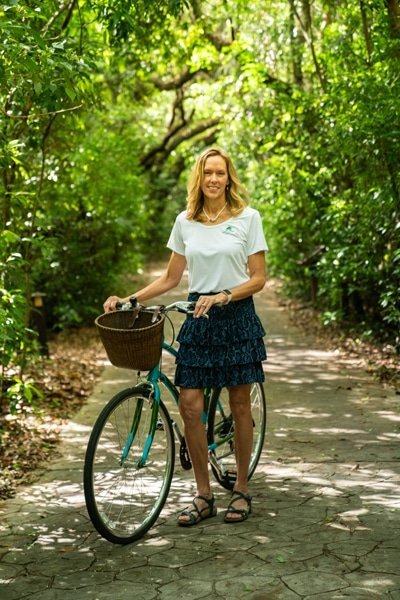 woman standing bicycle tropical hammock forest