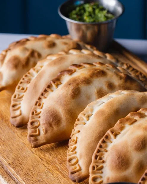 Brunch hand pies with dipping sauce on the side.