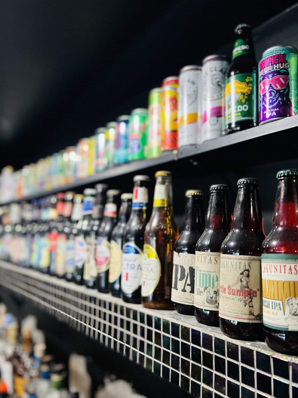 A shelf of a variety of beers.