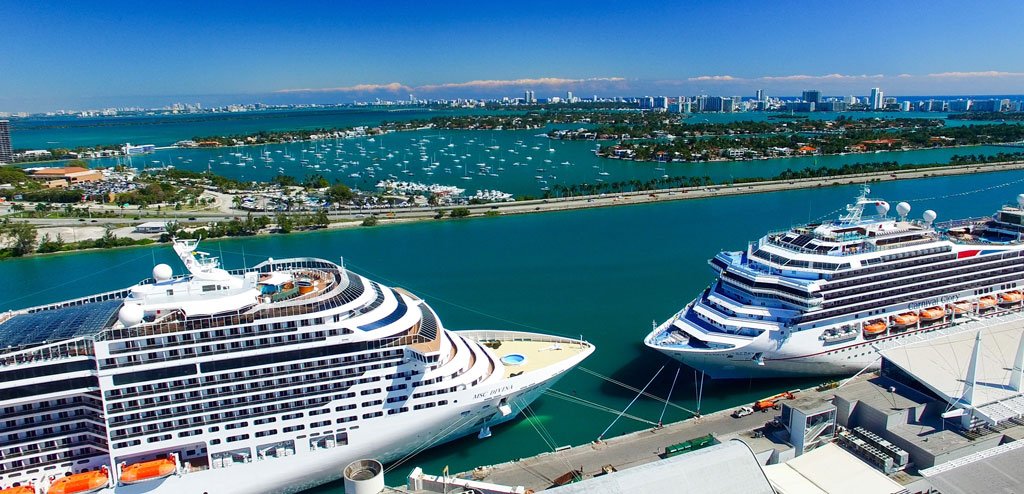 view from above miami port with two cruise ships and causeway on a bright sunny day