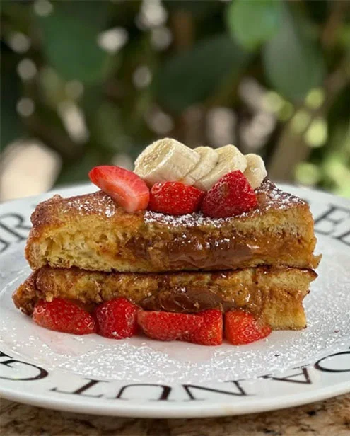 French toast topped with bananas and strawberries