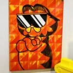 A painting of Garfield the cat in a modern style with sunglasses.