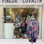 A front window display for Pineda Covalin that has a mannequin wearing an outfit.