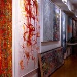 A bunch of paintings hanging inside of Grove Fine Art Center, Coconut Grove, FL.