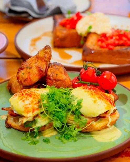 brunch dish garnished with parsley and tomato