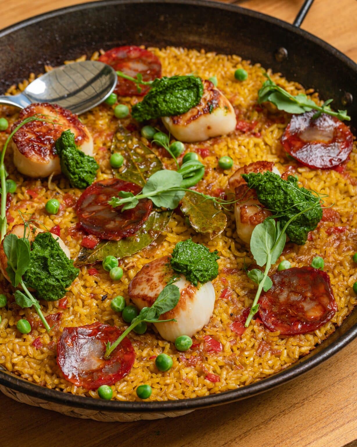 Level 6 food dish with scallops and rice and peas.