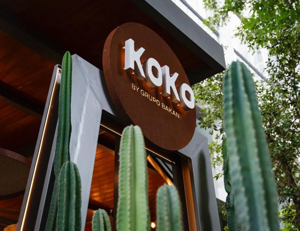 Koko sign outside of the building with cactus