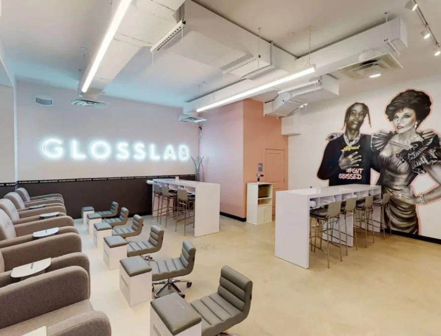 Interior of Glosslab salon with chairs.