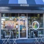 The exterior building and outdoor sitting area of Juicense in Coconut Grove, FL.