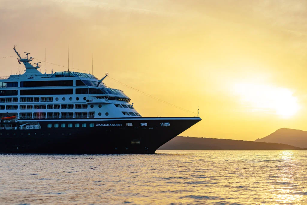 Azamara Cruise ship sailing at sunset.