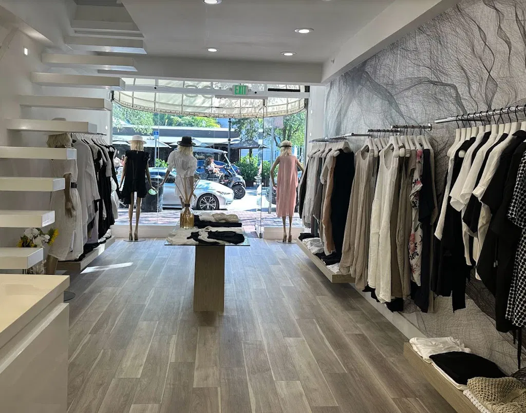 The interior of a store named DIGS, featuring curated clothing.