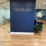 Law Firm of Joseph R. Lackey, LLC interior phot of the office wall with a name sign.