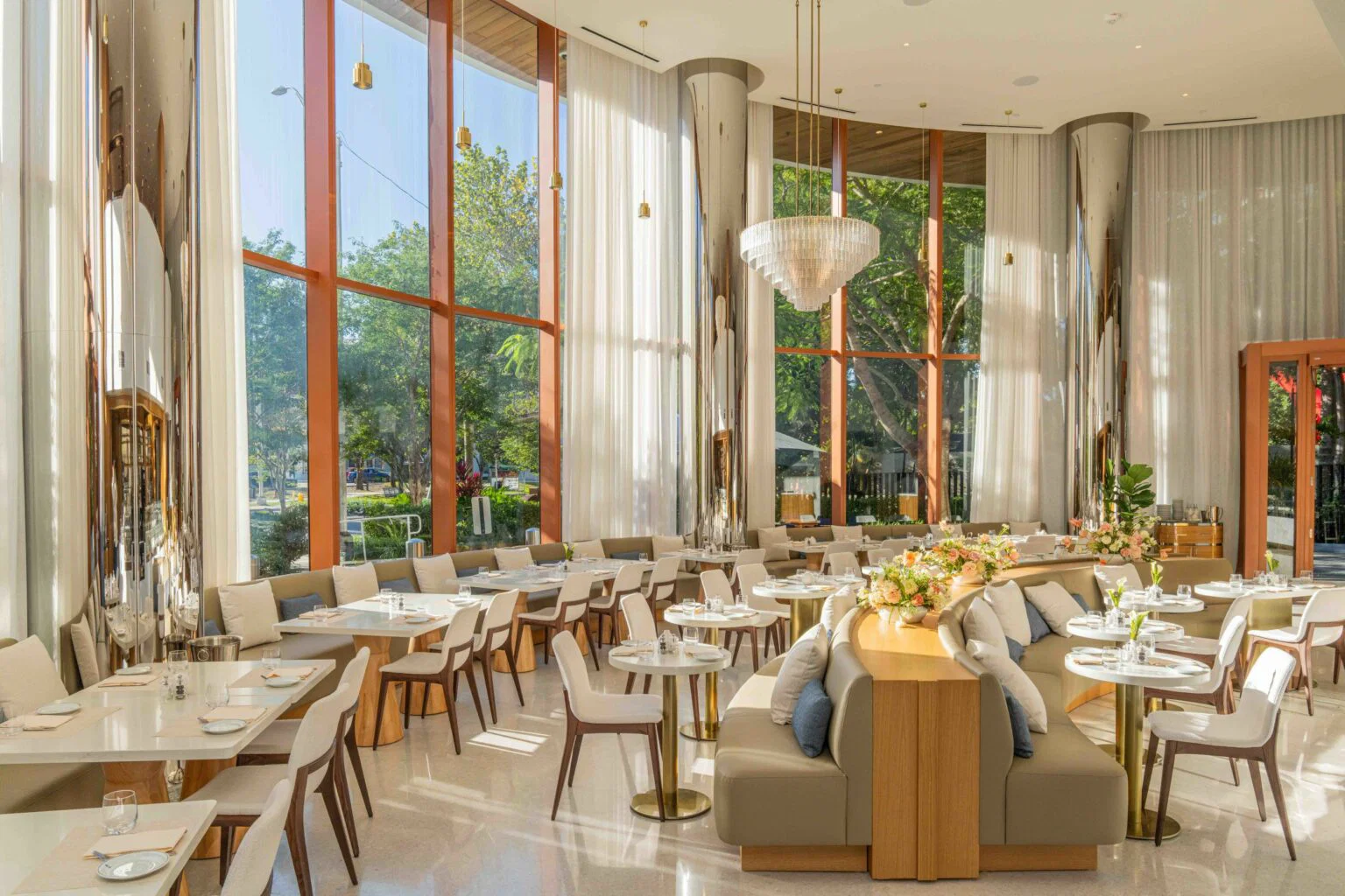 Bright, modern cafe seating area with large windows