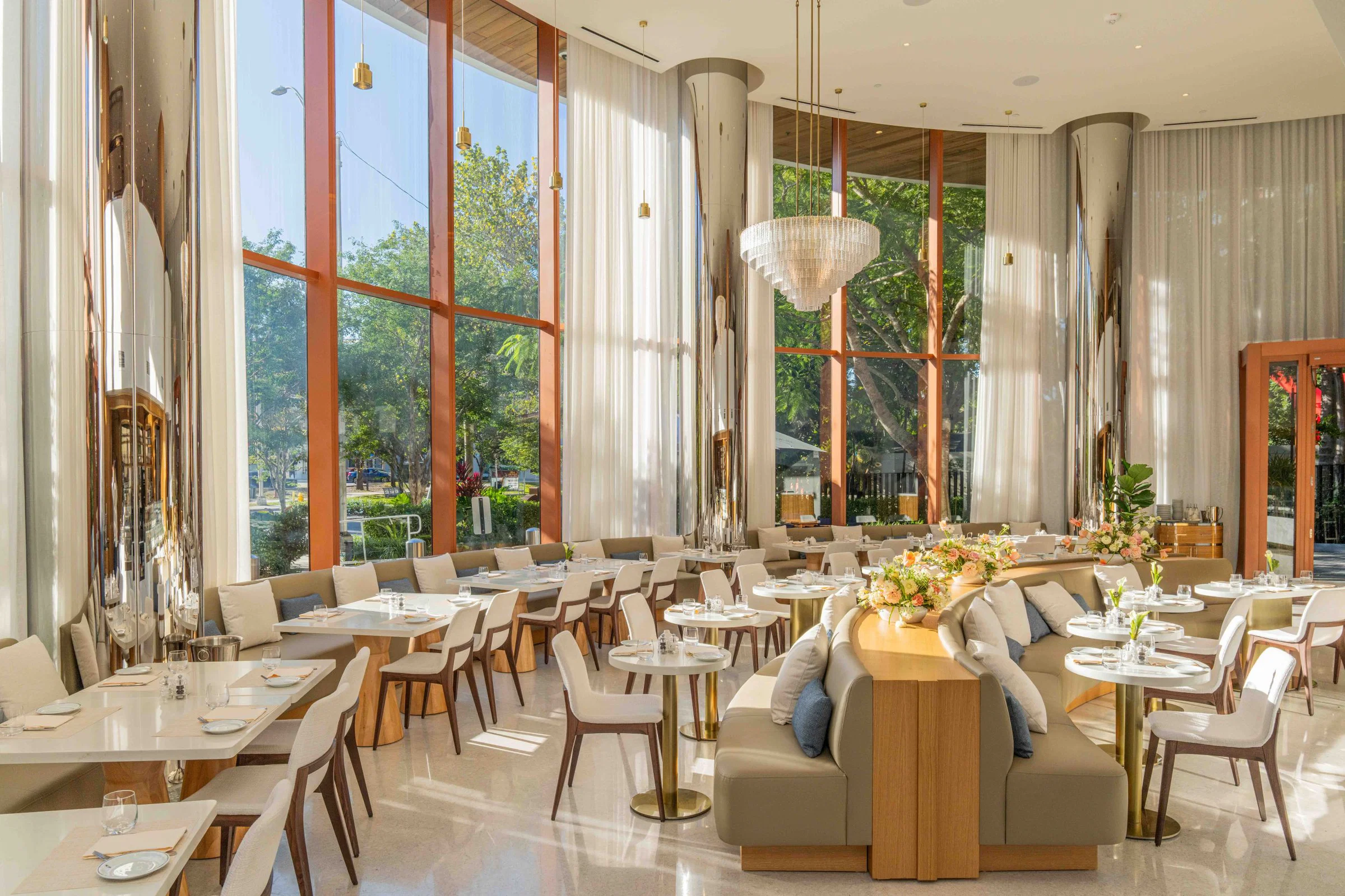 Bright, modern cafe seating area with large windows