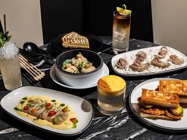 a variety of dishes for Mae’s room in Coconut grove on a marble table.