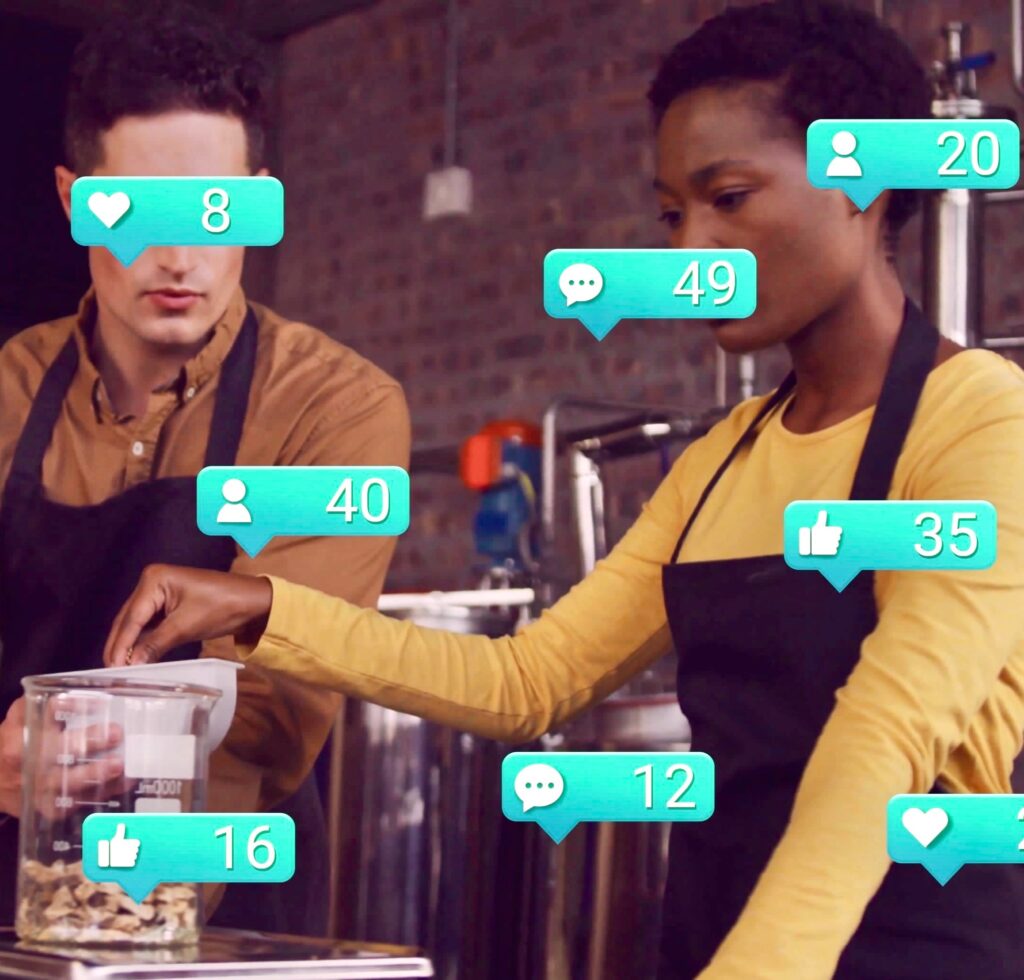 Image of social media icons with numbers over diverse male and female baristas. Global business, finances, computing and digital interface concept digitally generated image.