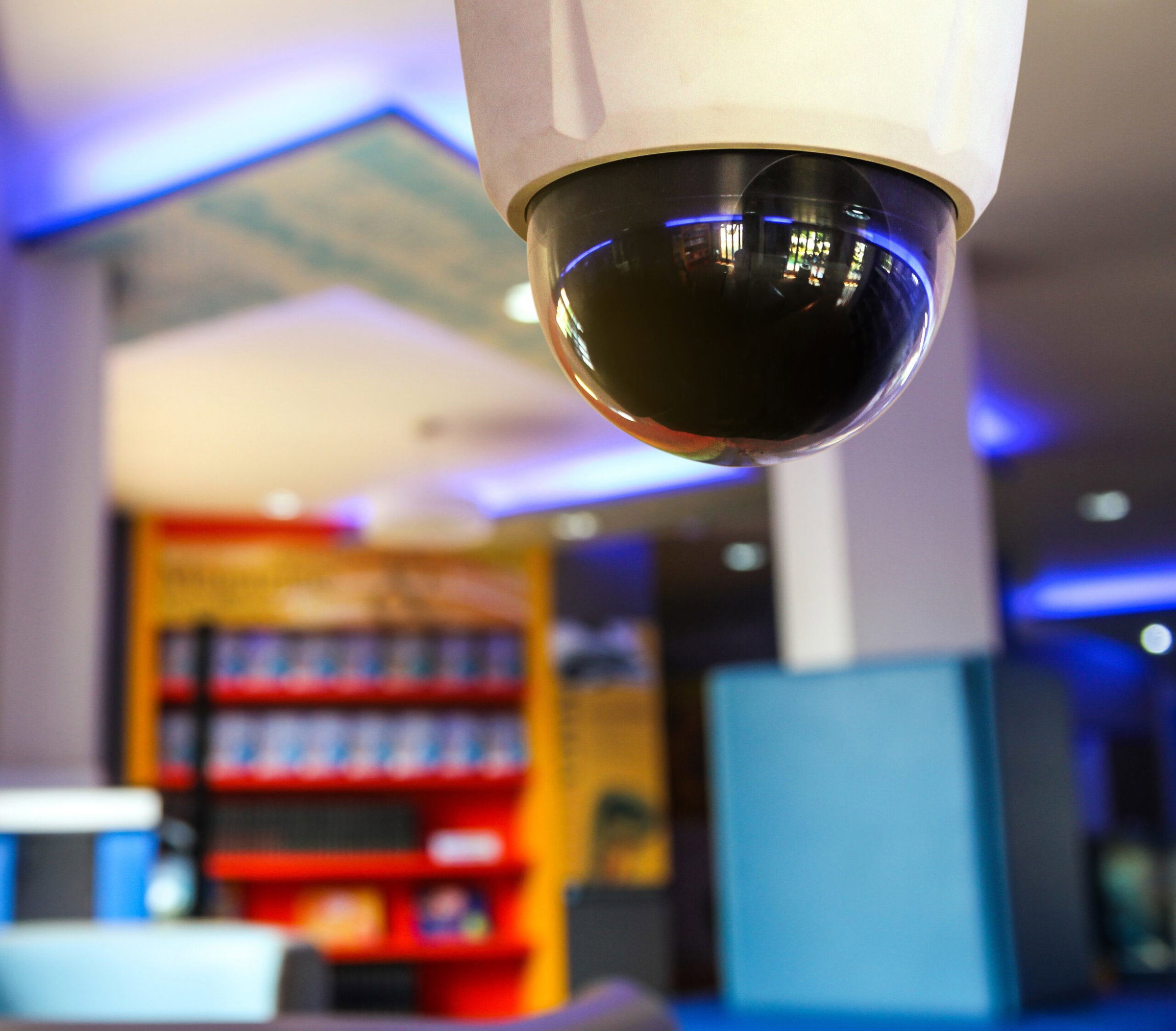 Indoor security camera installed into a business ceiling.