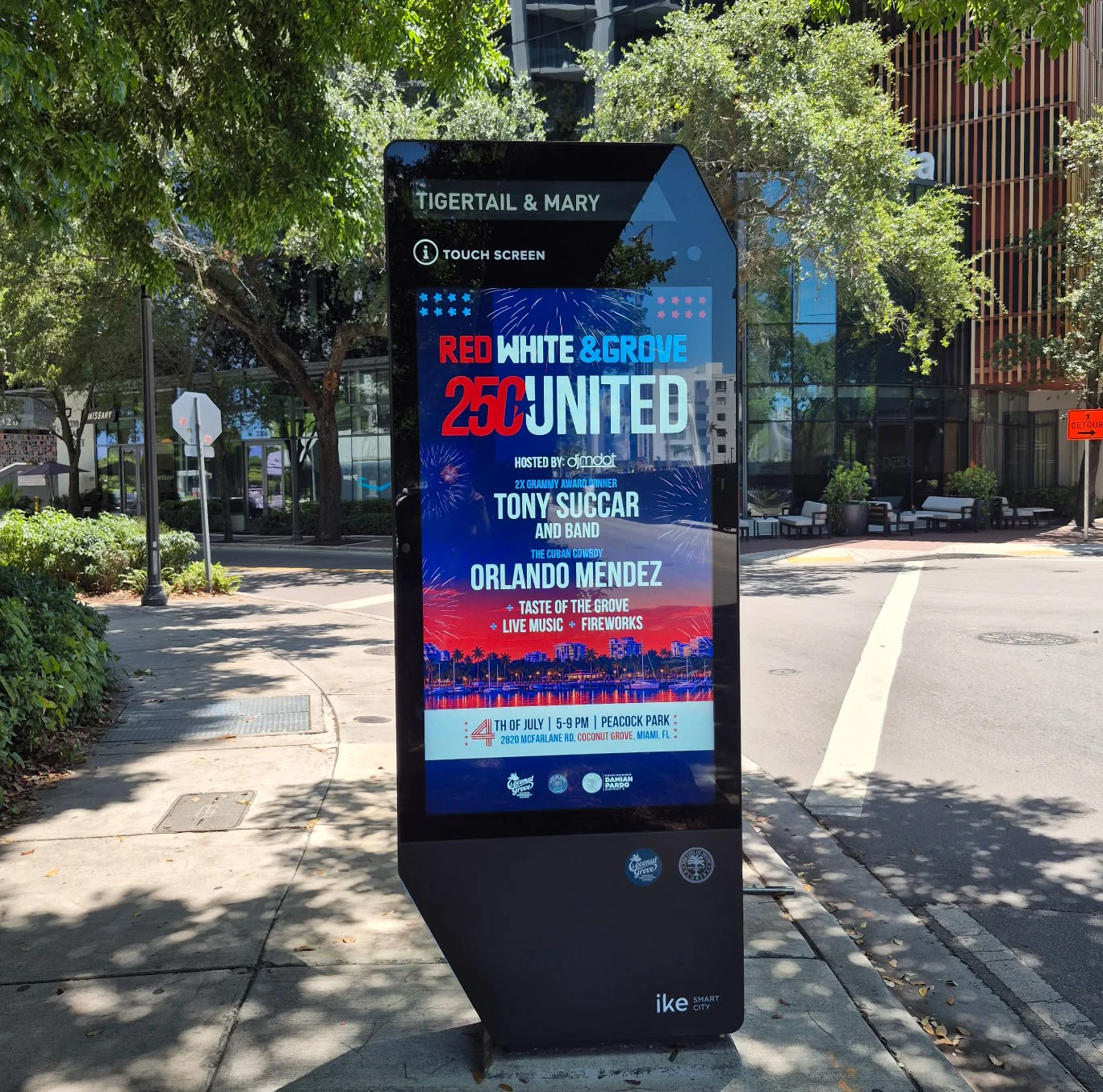 Outside kiosks advertising flyers for celebrations in Coconut Grove.