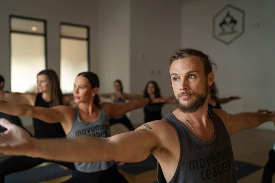 People doing Yoga poses in a studio