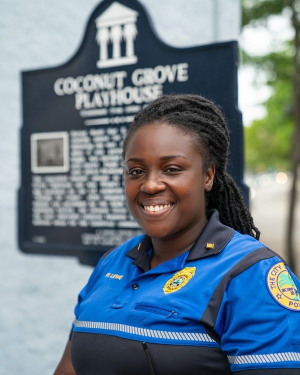 police woman smiling historical plaque
